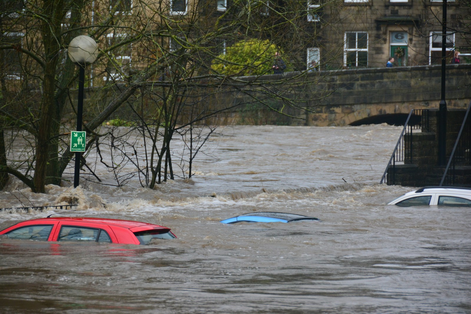 car with flood insurance in body of water